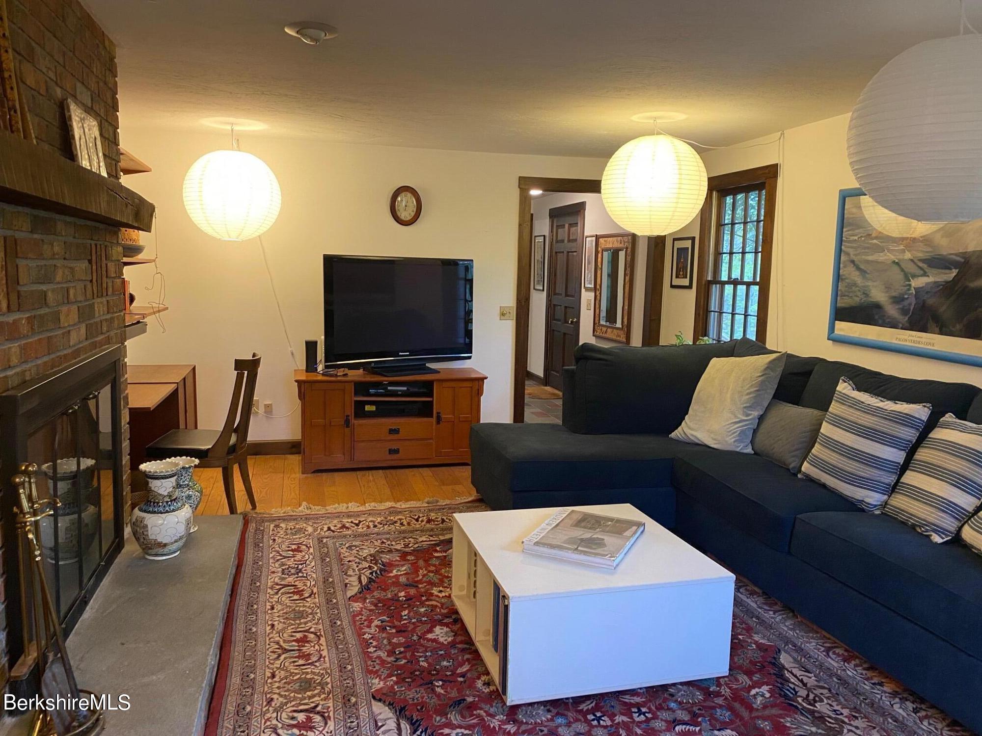 24 Andes Road Peru, MA 01235 - Photo 43 of 56 a living room with furniture and a flat screen tv