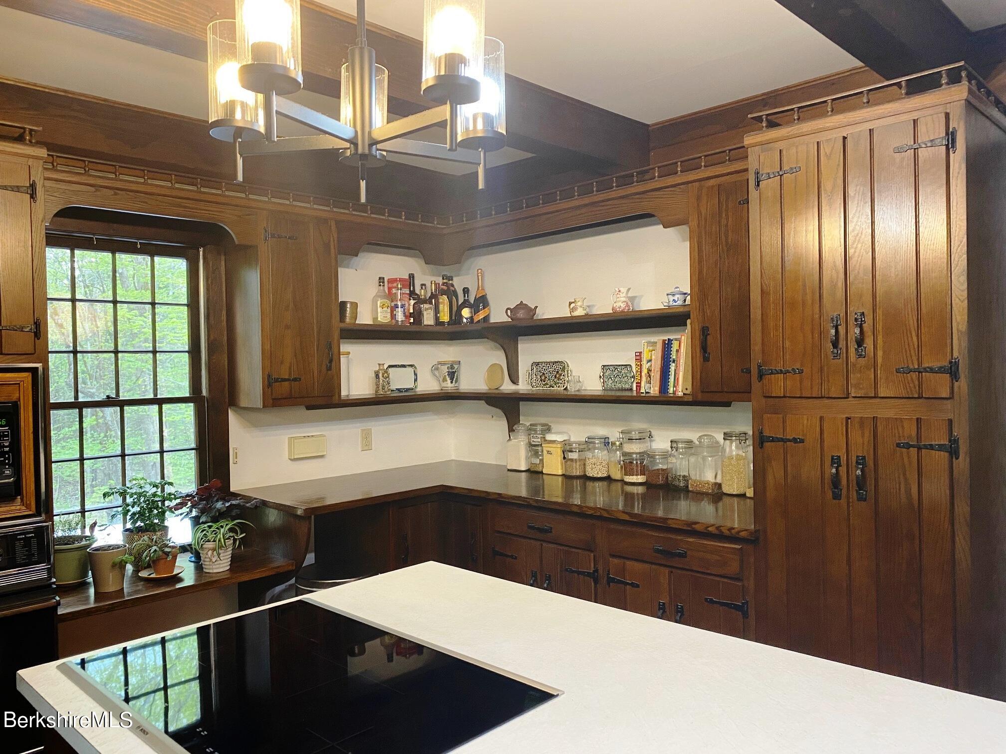 24 Andes Road Peru, MA 01235 - Photo 49 of 56 a kitchen with stainless steel appliances kitchen island granite countertop a refrigerator and a sink
