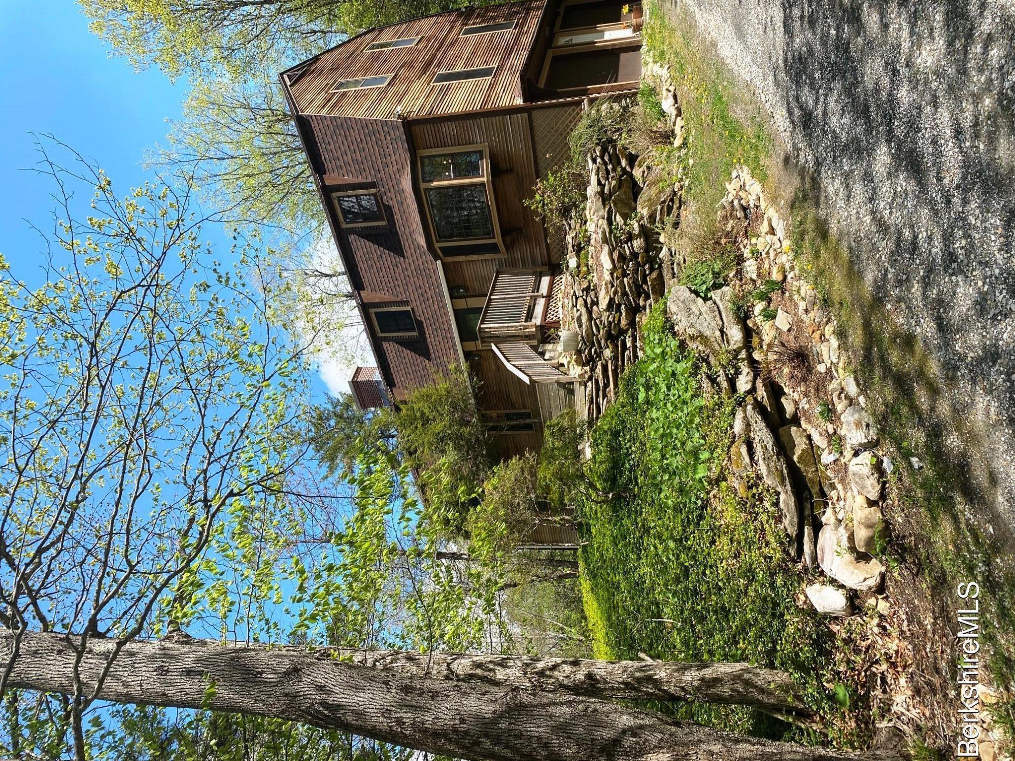 24 Andes Road Peru, MA 01235 - Photo 5 of 56 a front view of a house with garden