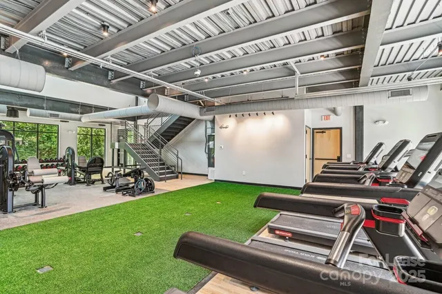 a view of a room with chairs and table in a patio