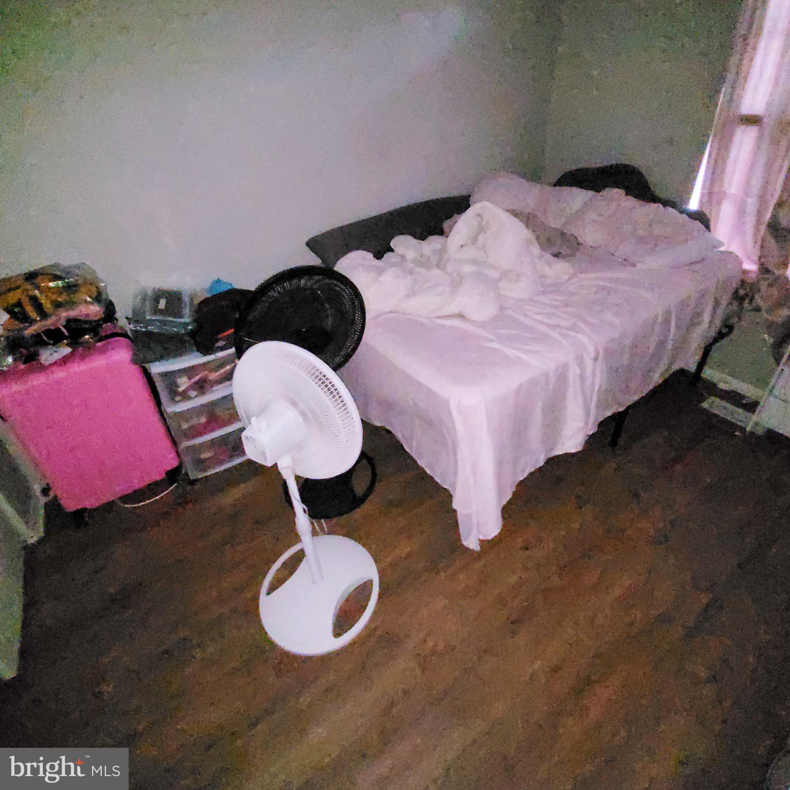672 Yorkshire Drive Edgewood, MD 21040 - Photo 19 of 35 a bedroom with a bed and a chandelier