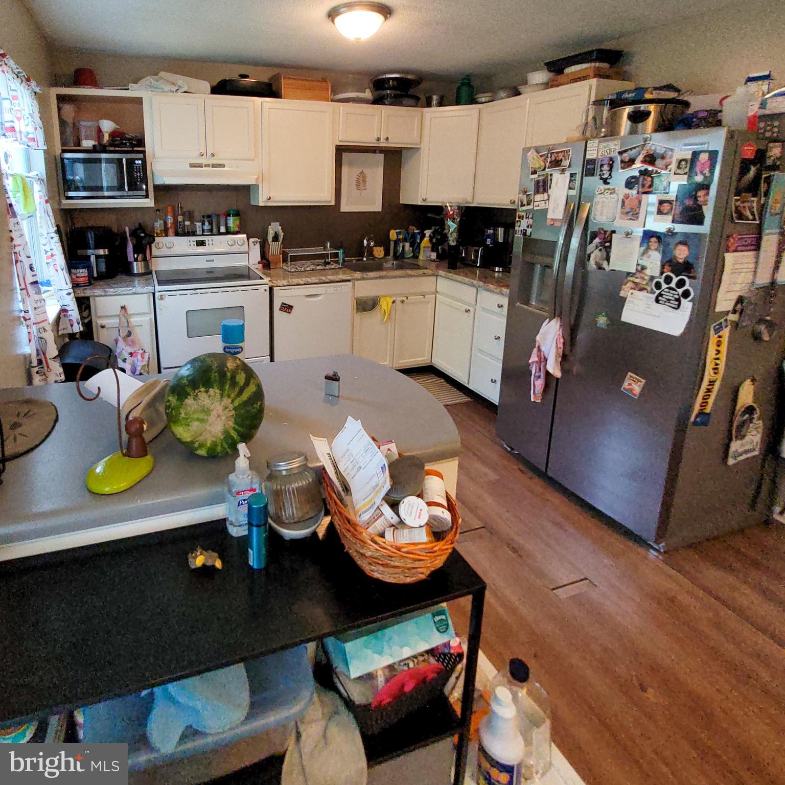 672 Yorkshire Drive Edgewood, MD 21040 - Photo 5 of 35 a kitchen with sink refrigerator and stove