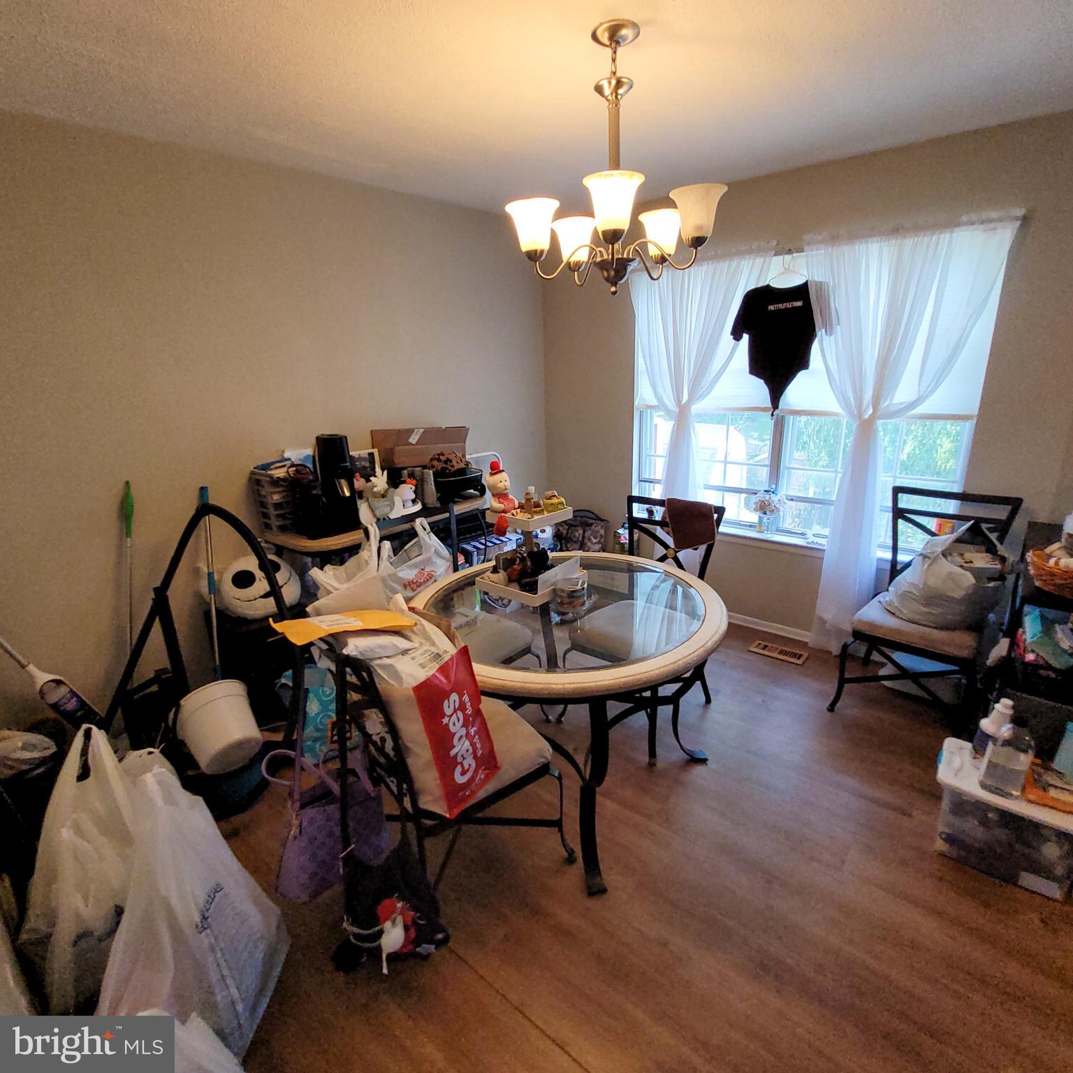 672 Yorkshire Drive Edgewood, MD 21040 - Photo 7 of 35 a very nice looking room with furniture and a chandelier