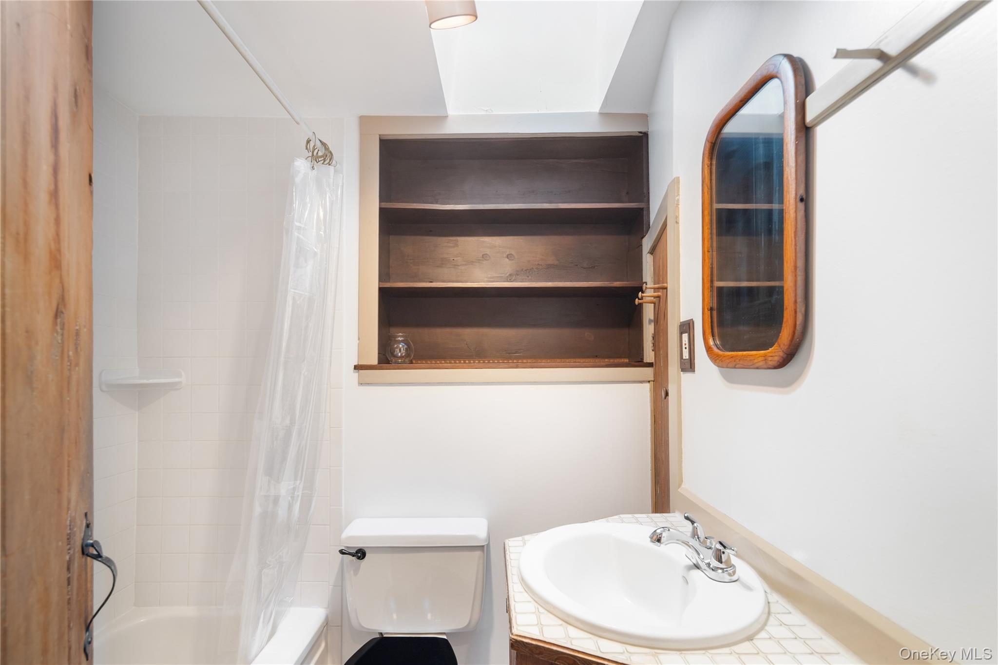 689 South Mountain Road New City, NY 10956 - Photo 15 of 28 a bathroom with a toilet and a sink