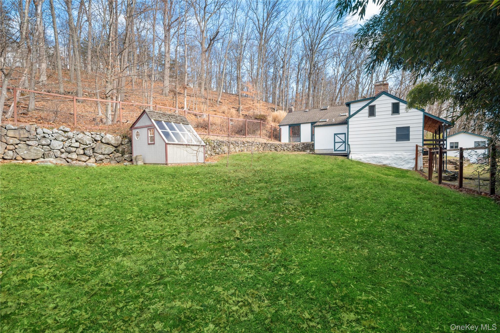 689 South Mountain Road New City, NY 10956 - Photo 23 of 28 a view of a house with backyard and a tree