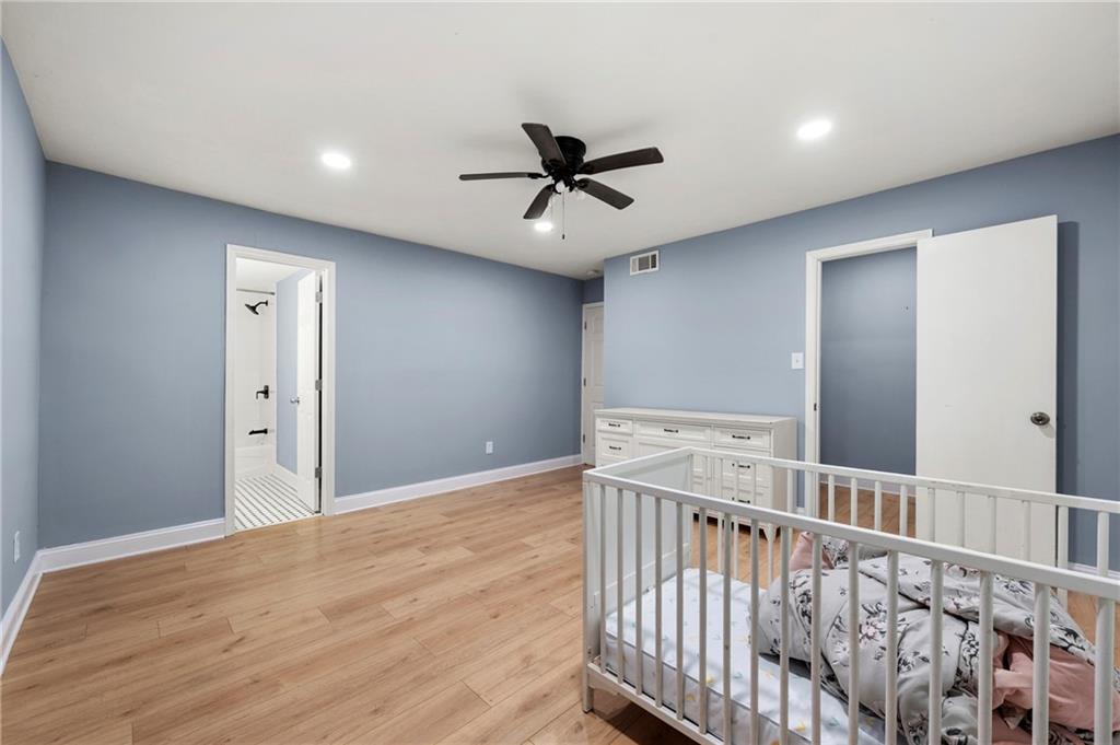 6708 Baynes Hill Circle Clarkston, GA 30021 - Photo 11 of 17 a view of a hallway with a ceiling fan