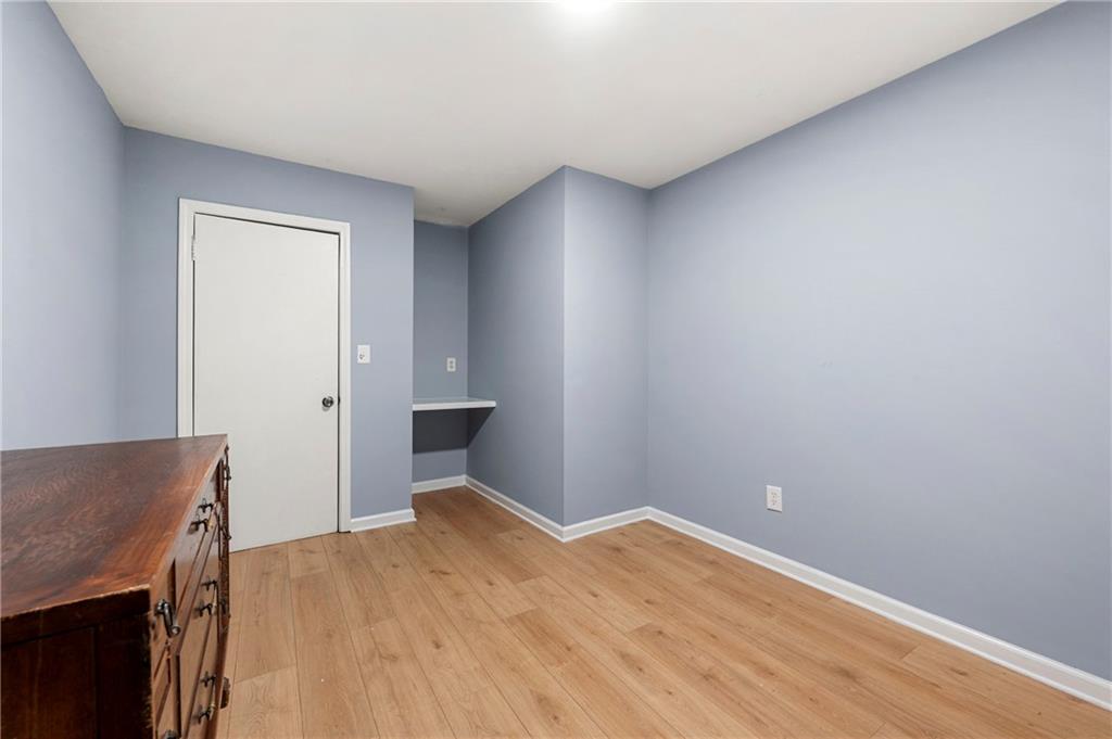 6708 Baynes Hill Circle Clarkston, GA 30021 - Photo 13 of 17 a view of empty room with wooden floor