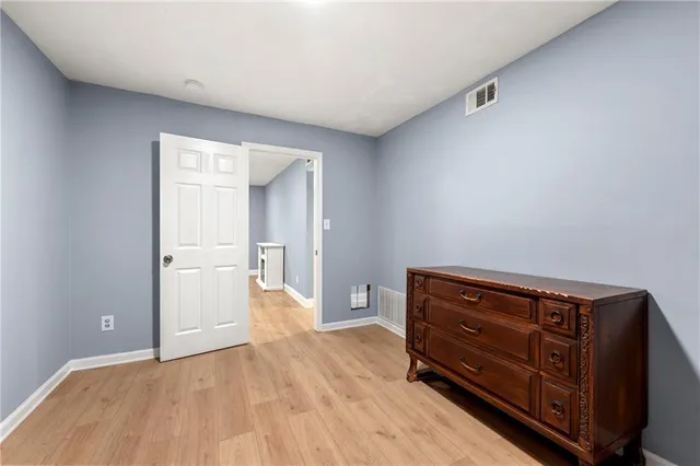 a view of room with wooden floor