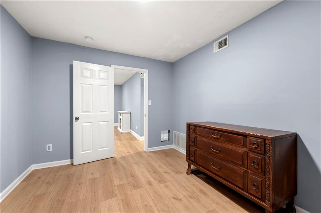 6708 Baynes Hill Circle Clarkston, GA 30021 - Photo 14 of 17 a view of room with wooden floor