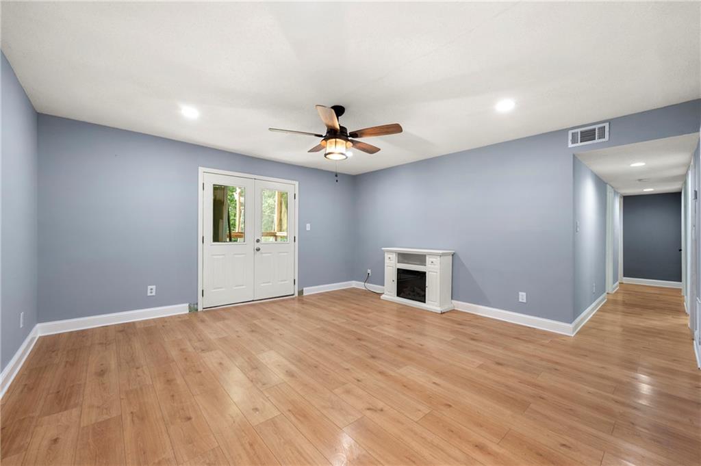 6708 Baynes Hill Circle Clarkston, GA 30021 - Photo 7 of 17 a view of an empty room with window and a kitchen