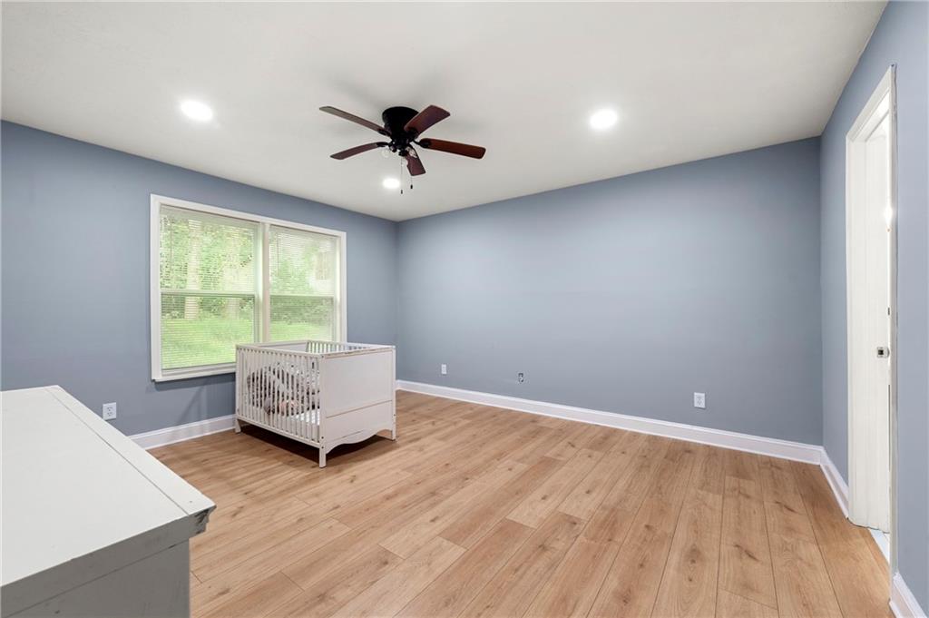 6708 Baynes Hill Circle Clarkston, GA 30021 - Photo 10 of 17 a living room with hard wood floors and a window