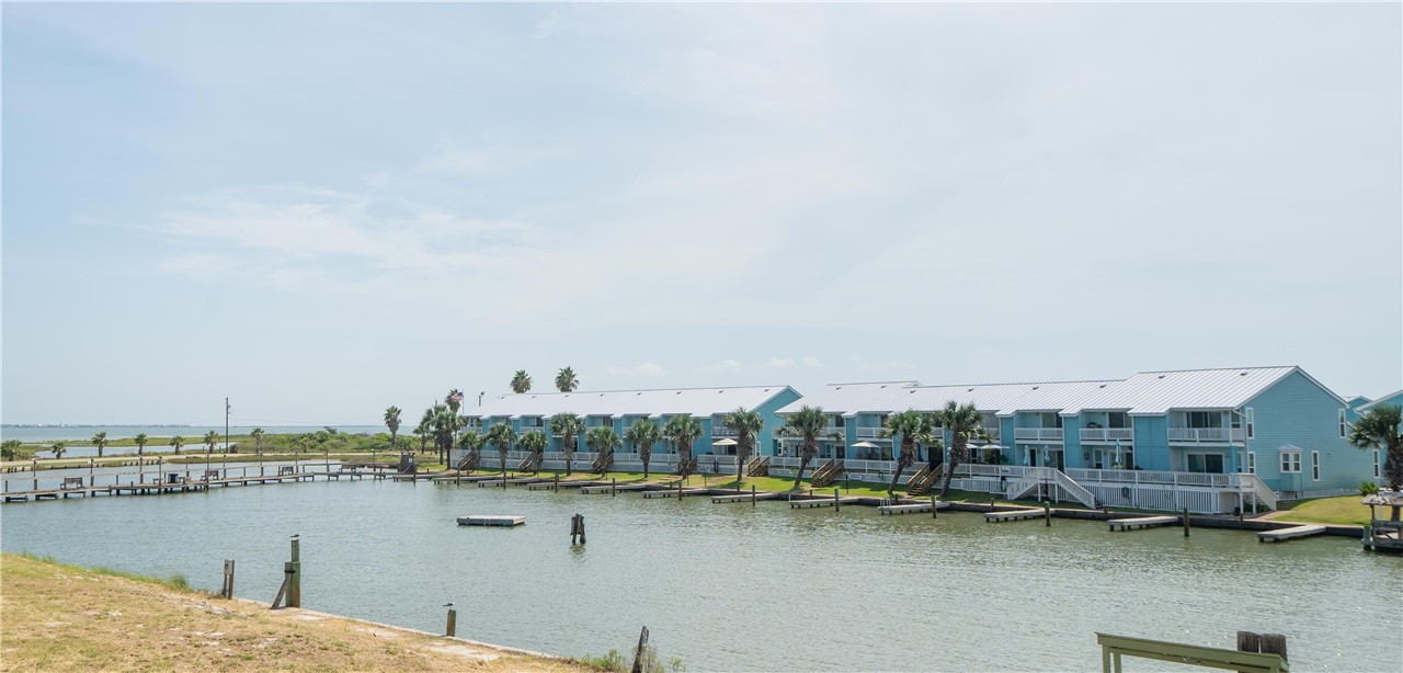 2290 North Fulton Beach Road Rockport, TX 78382 - Photo 7 of 26 a view of a lake with a city