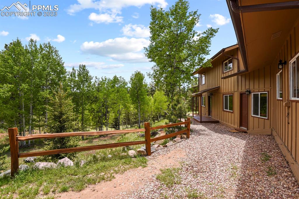 286 Ridge Road Divide, CO 80814 - Photo 3 of 27 a view of a bench in front of a house