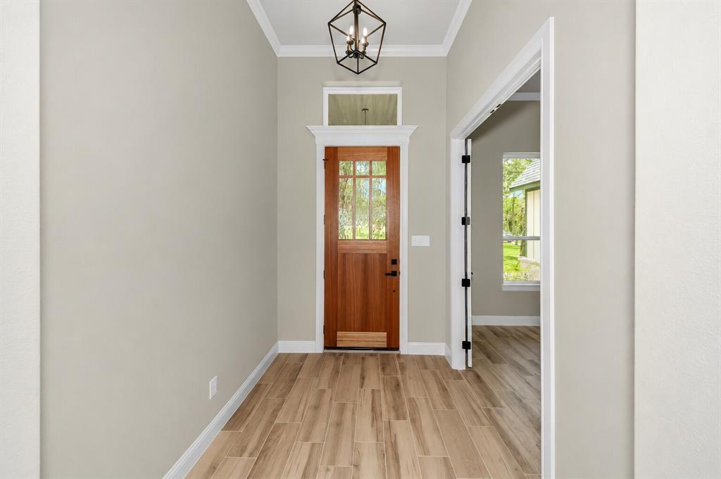 1057 Vh Ranch Poolville, TX 76487 - Photo 5 of 38 a view of an entryway with wooden floor