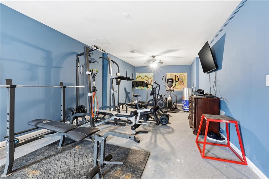 14 Isabella Court Cartersville, GA 30121 - Photo 15 of 33 a room with gym equipment and view of living room