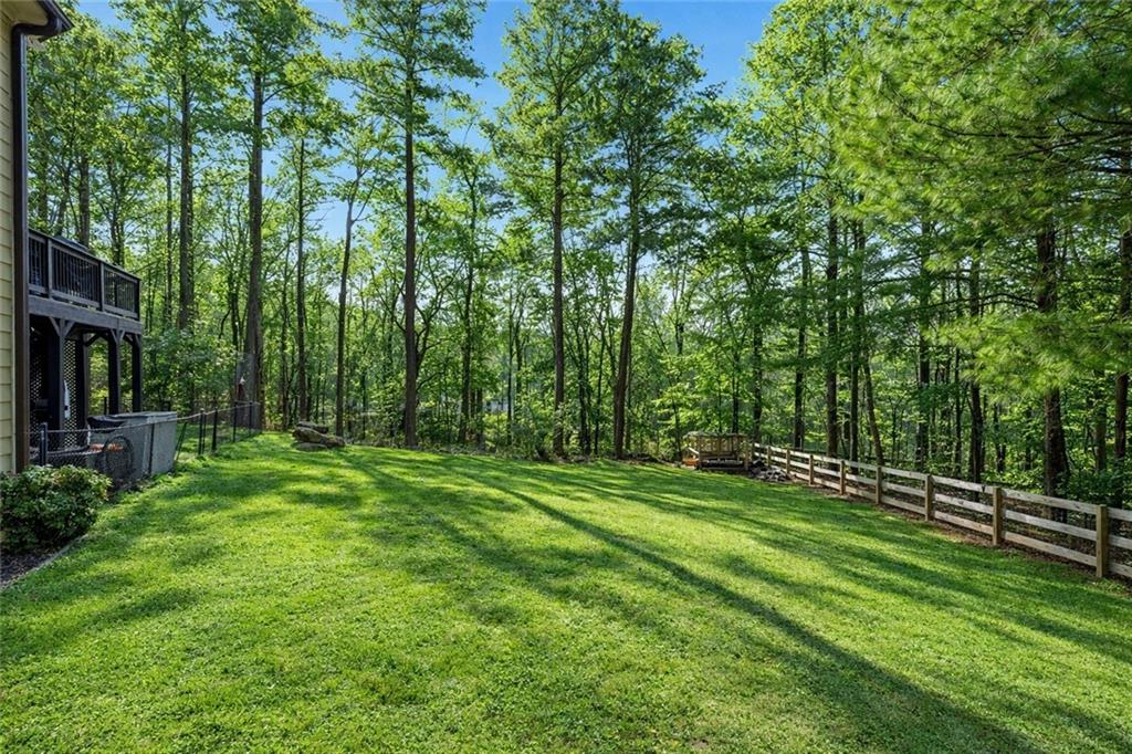 14 Isabella Court Cartersville, GA 30121 - Photo 18 of 33 a big yard with lots of green space and trees