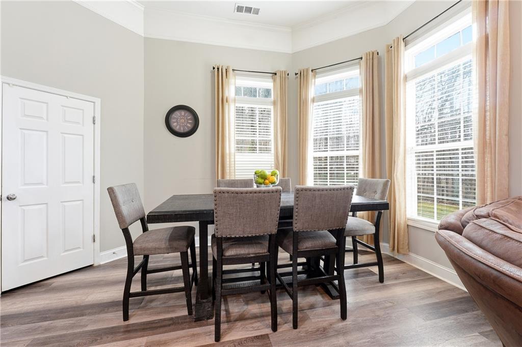 14 Isabella Court Cartersville, GA 30121 - Photo 20 of 33 a view of a dining room with furniture window and wooden floor