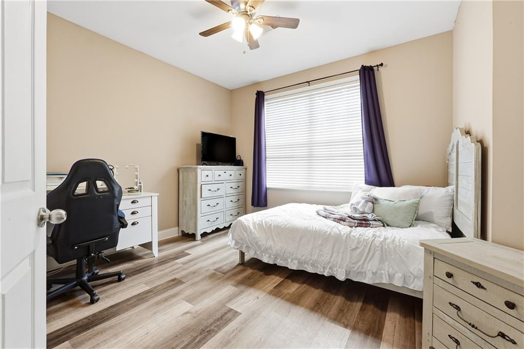 14 Isabella Court Cartersville, GA 30121 - Photo 21 of 33 a bedroom with a bed and a tv on the dresser