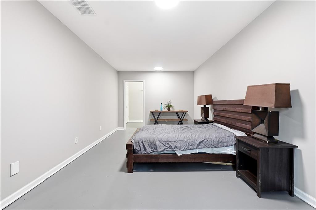 14 Isabella Court Cartersville, GA 30121 - Photo 24 of 33 a bedroom with a bed and wooden floor