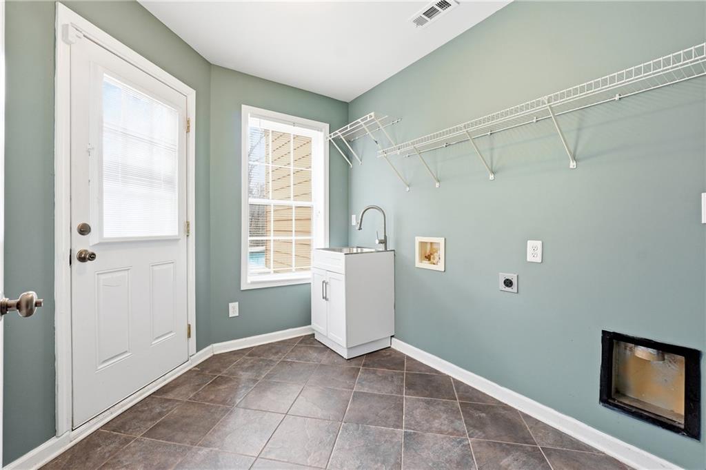 14 Isabella Court Cartersville, GA 30121 - Photo 26 of 33 a view of a storage & utility room with a window