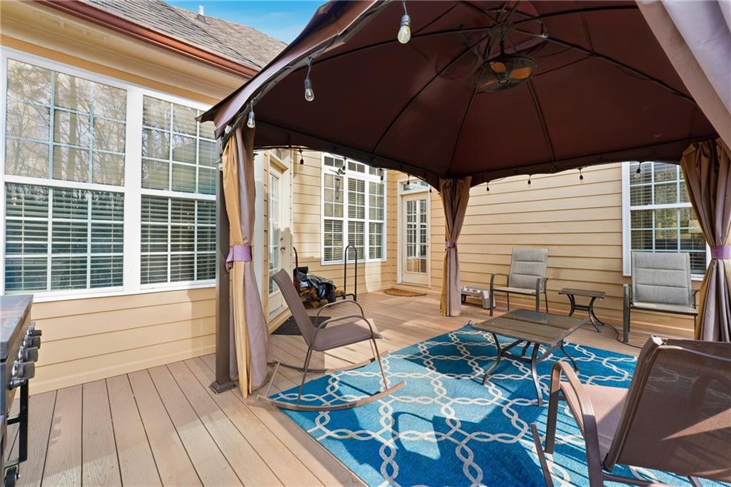 14 Isabella Court Cartersville, GA 30121 - Photo 27 of 33 a view of balcony with chairs and wooden floor