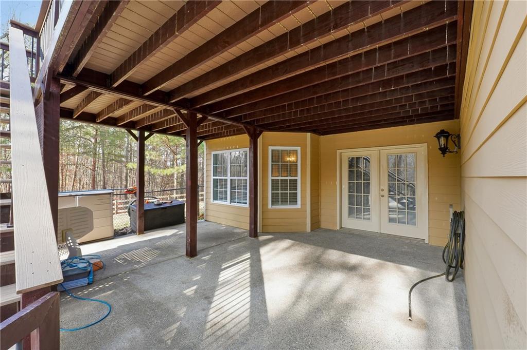 14 Isabella Court Cartersville, GA 30121 - Photo 28 of 33 a view of a porch with furniture and floor to ceiling window