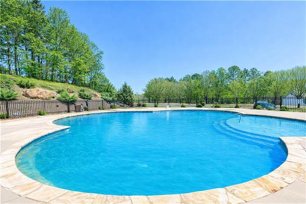 14 Isabella Court Cartersville, GA 30121 - Photo 30 of 33 a view of a swimming pool with an outdoor space and seating area