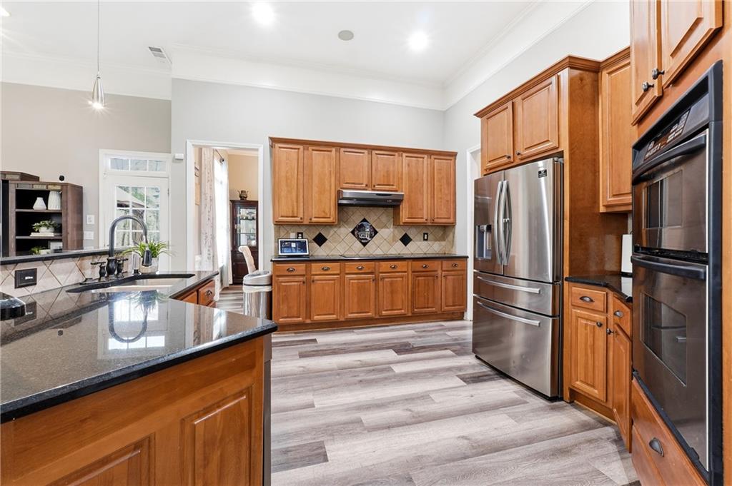 14 Isabella Court Cartersville, GA 30121 - Photo 9 of 33 a kitchen with stainless steel appliances a refrigerator sink and stove