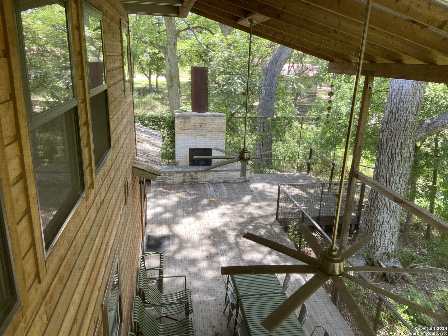 412 Lebouf Road Utopia, TX 78884 - Photo 12 of 42 a view of a porch with wooden floor and outdoor seating