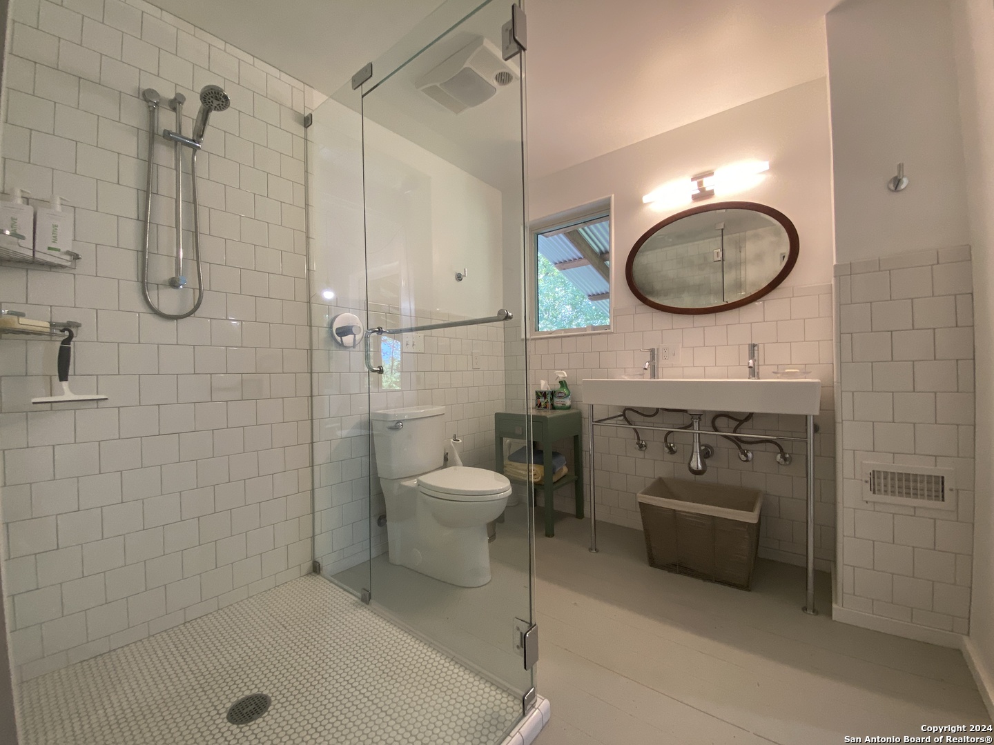 412 Lebouf Road Utopia, TX 78884 - Photo 13 of 42 a bathroom with a toilet a sink and mirror