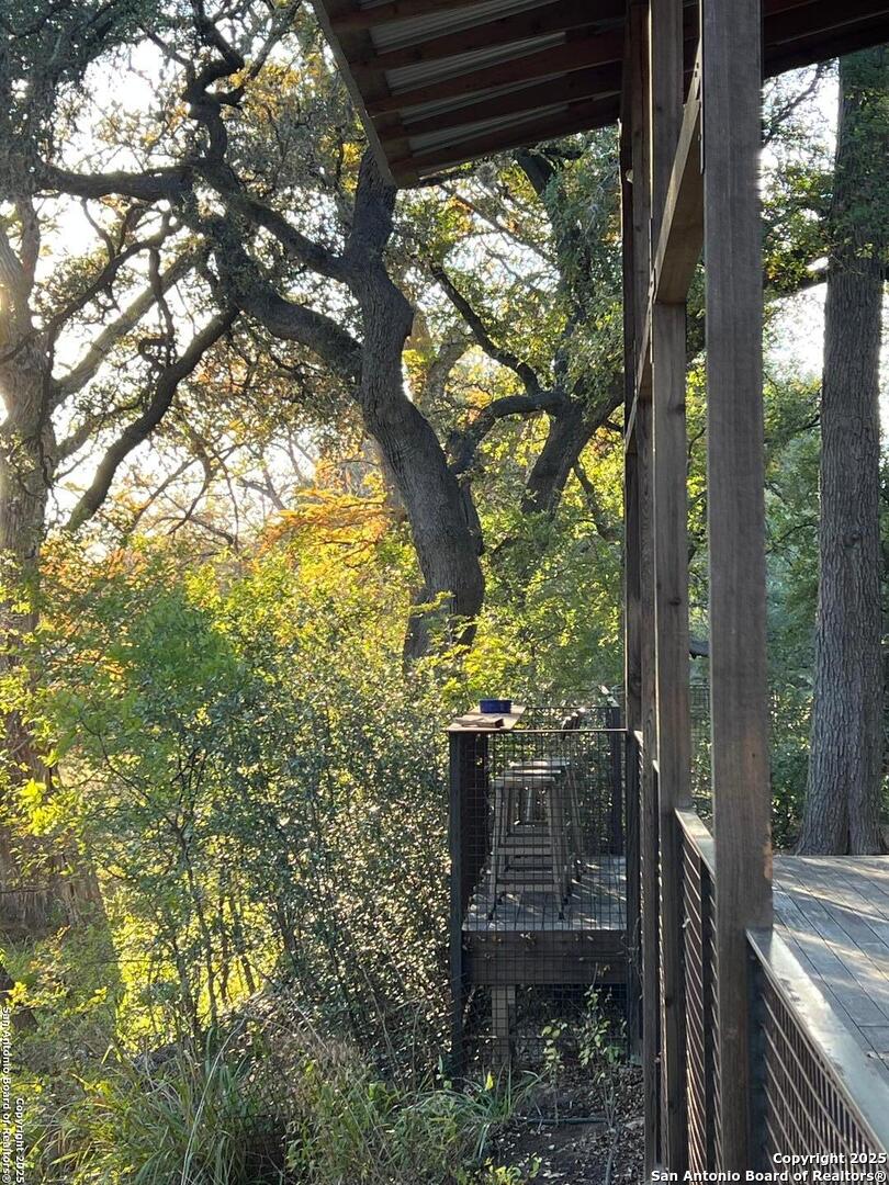 412 Lebouf Road Utopia, TX 78884 - Photo 14 of 42 a view of a porch with a tree in front of it