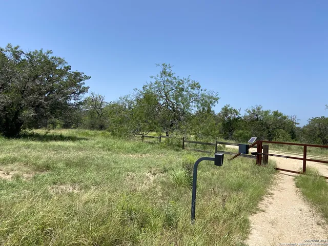 a bedroom with a bed and a night stand