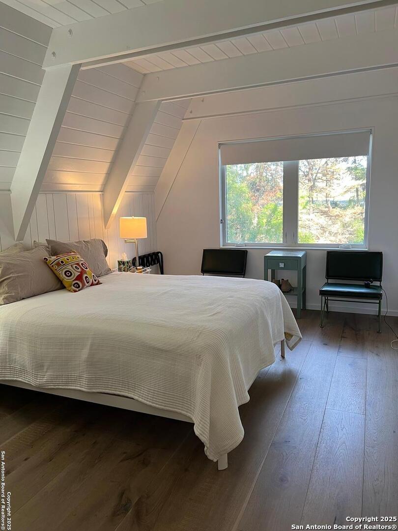 412 Lebouf Road Utopia, TX 78884 - Photo 26 of 42 a bedroom with a bed and a night stand