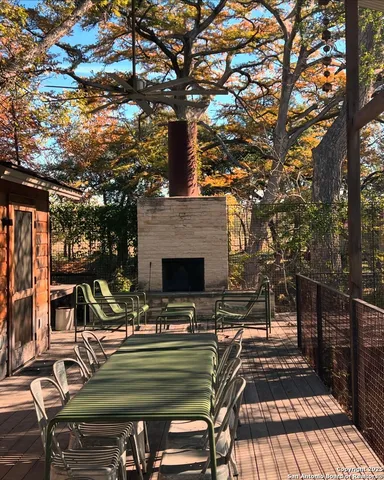 a view of balcony with wooden floor and outdoor seating