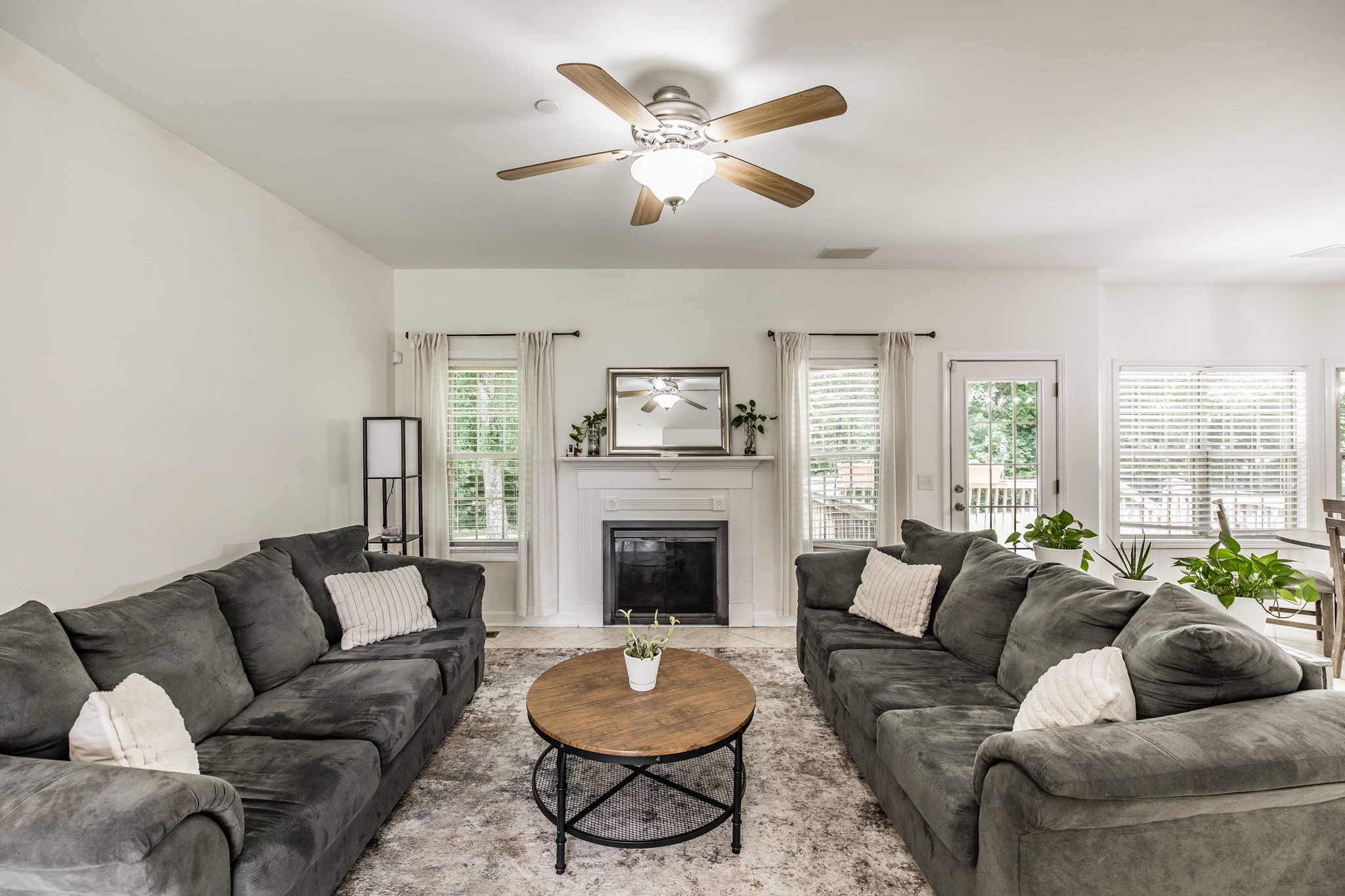 2860 Morgan Road Joelton, TN 37080 - Photo 12 of 45 a living room with furniture a fireplace and a large window