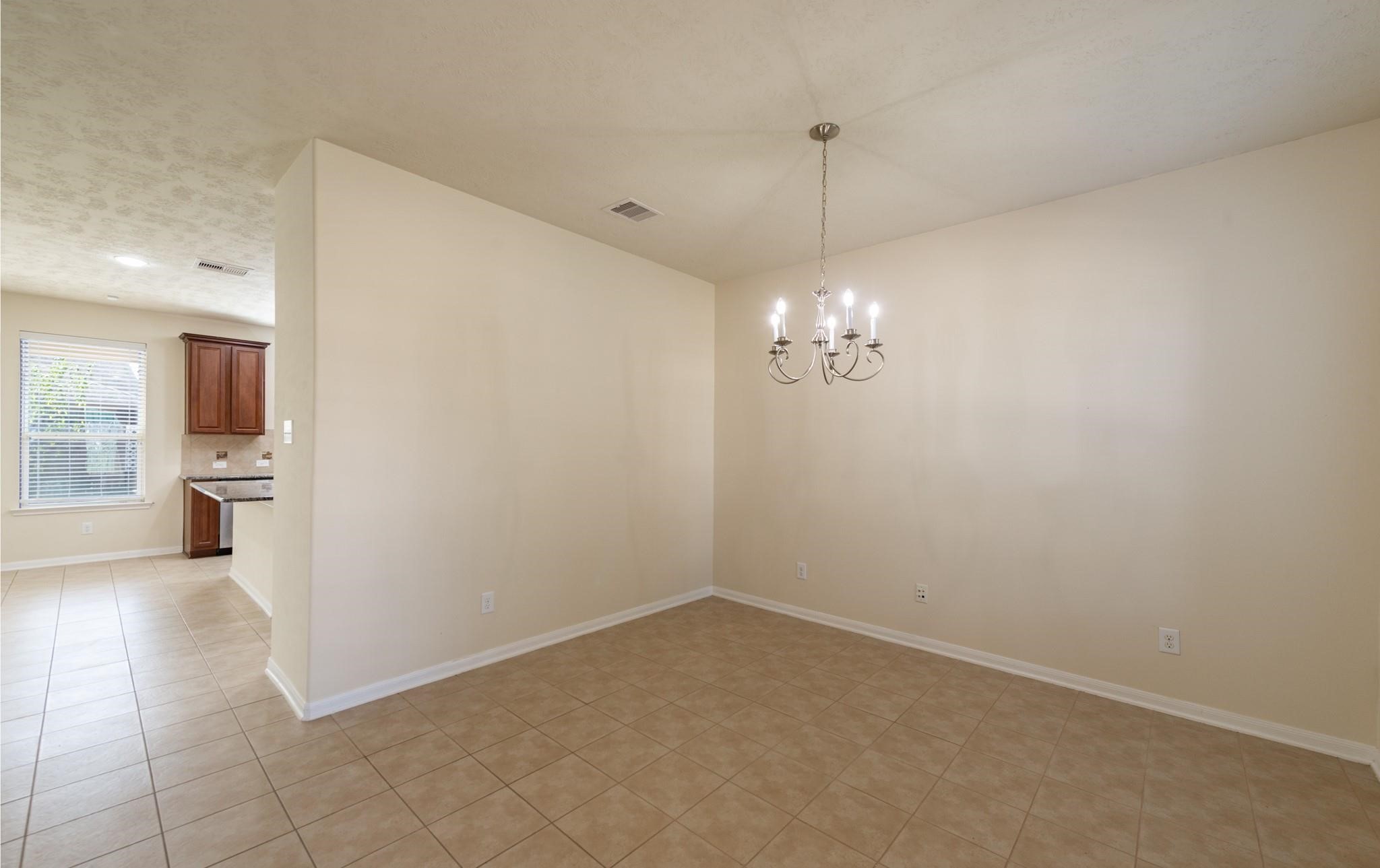 6402 Addlestone Ridge Lane Katy, TX 77494 - Photo 3 of 25 Formal dining room just off the entry provides the perfect space for holiday gatherings, dinner parties, or everyday meals. Tile flooring and an open layout create a seamless flow to the kitchen and main living areas.