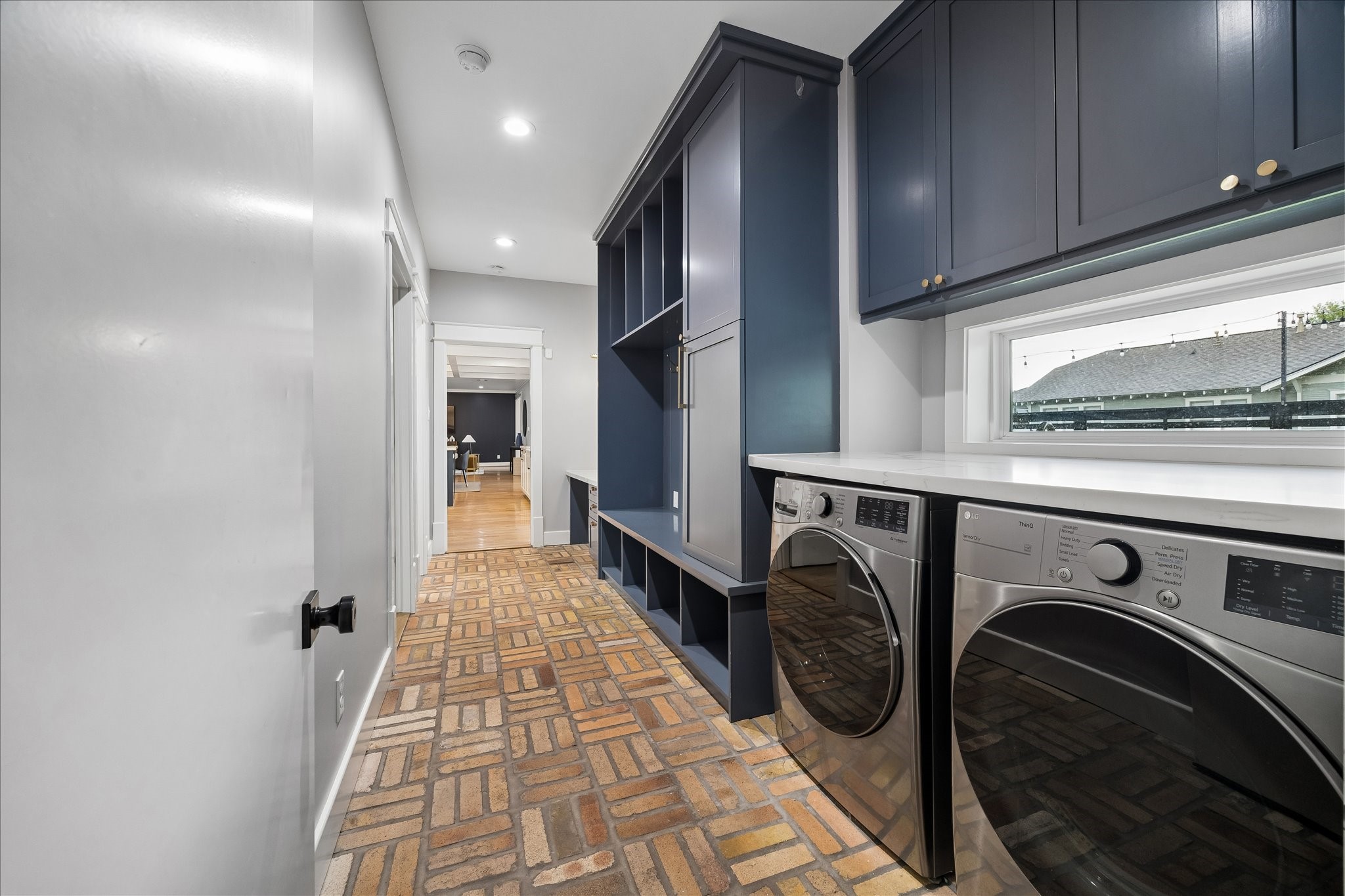 1205 Temple Street Houston, TX 77009 - Photo 30 of 33 Durable finishes, brick floors, and abundant cabinetry transform everyday tasks into an experience that's both functional and beautifully designed.