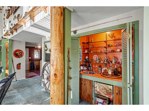 a bedroom with furniture and a rug