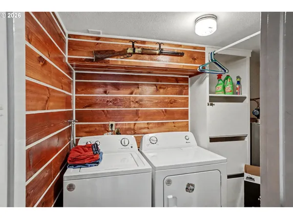 a room with workspace and a large window