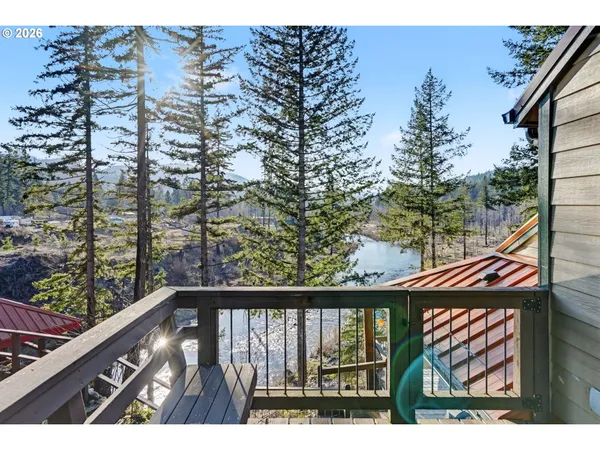a view of a chairs and table in a patio