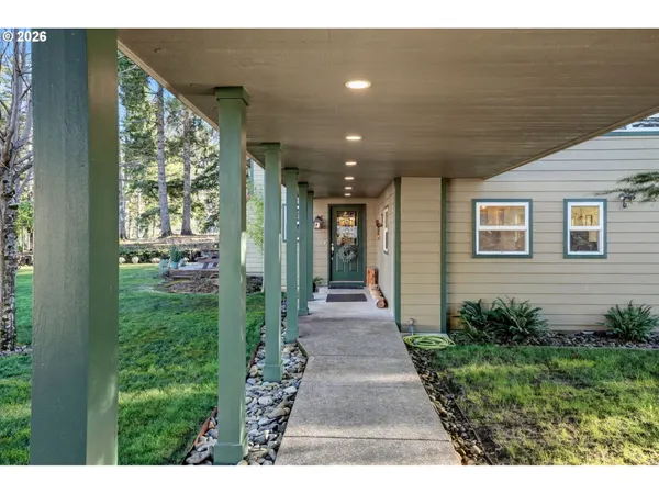 a view of that has entryway wooden floor and front door
