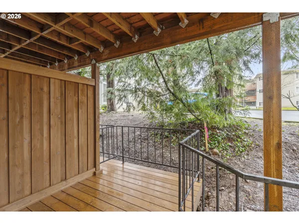 a view of balcony with wooden floor