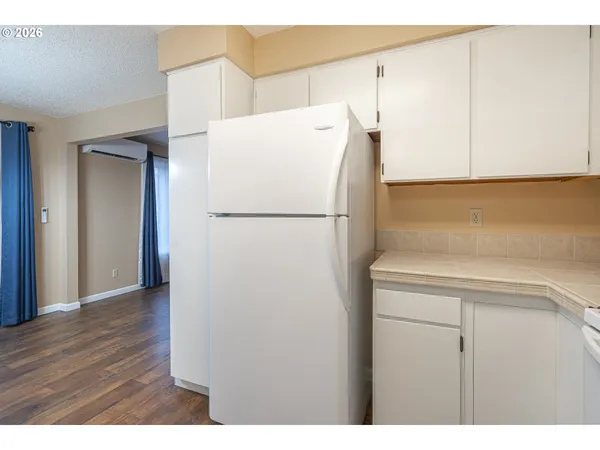 a white refrigerator freezer sitting in a kitchen