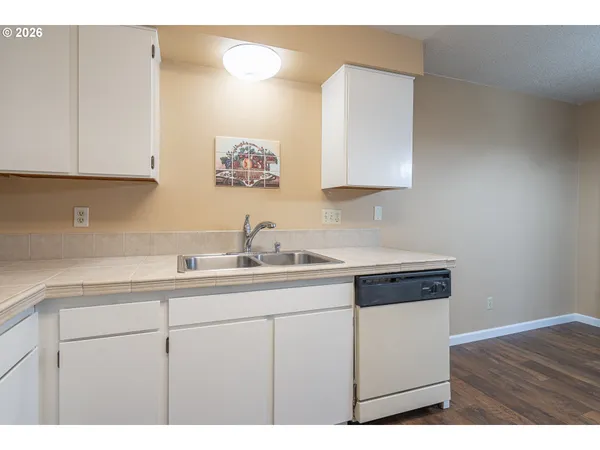 a kitchen with sink and cabinets