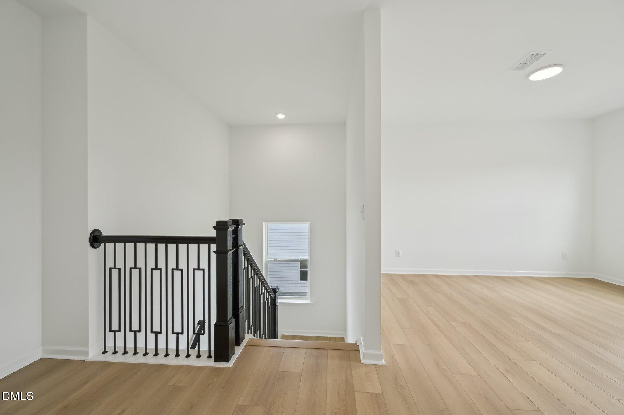 2205 Seraphic Way, Unit 403 Rolesville, NC 27571 - Photo 34 of 41 a view of hallway with wooden floor