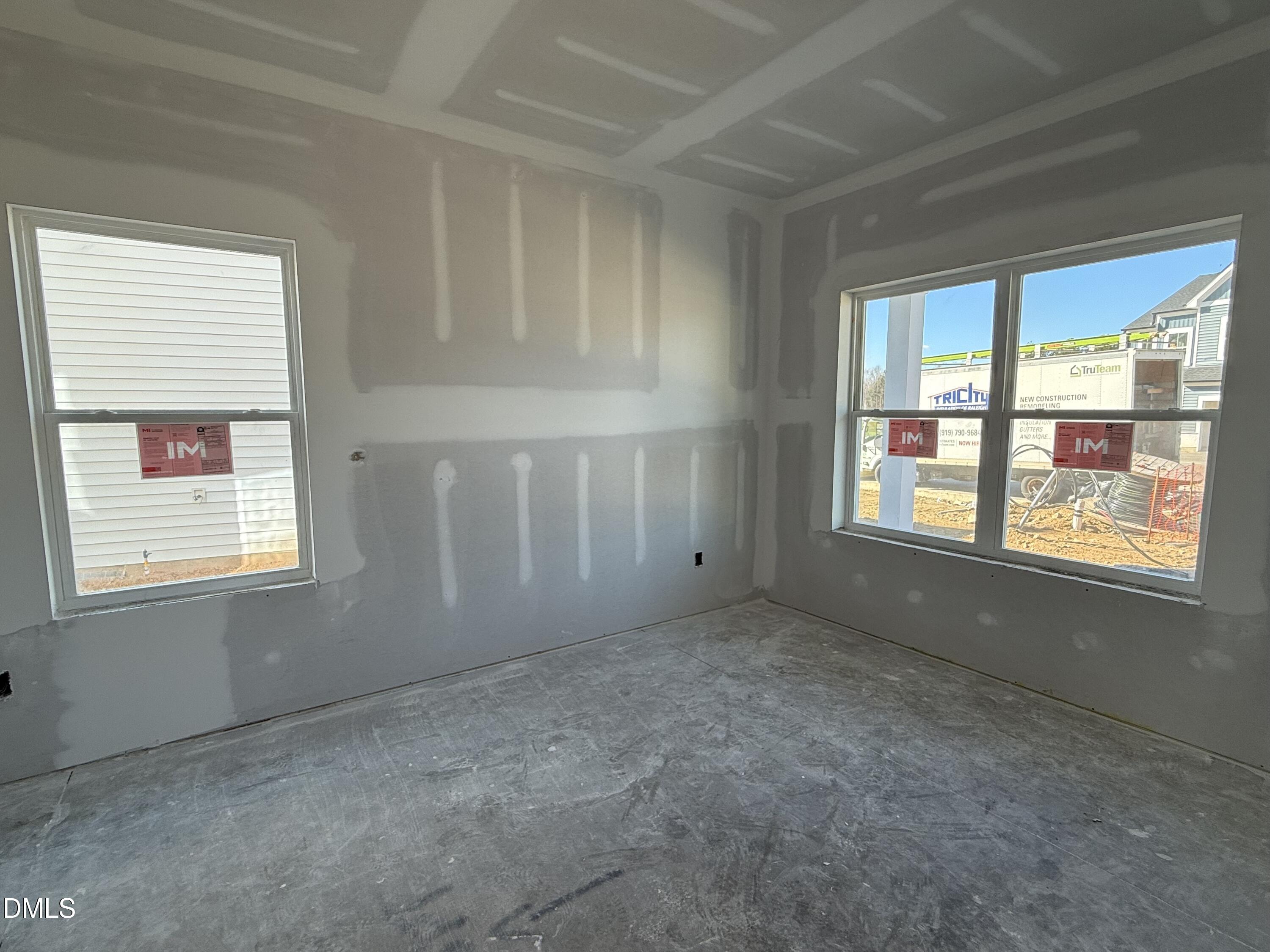 2205 Seraphic Way, Unit 403 Rolesville, NC 27571 - Photo 4 of 41 an empty room with windows