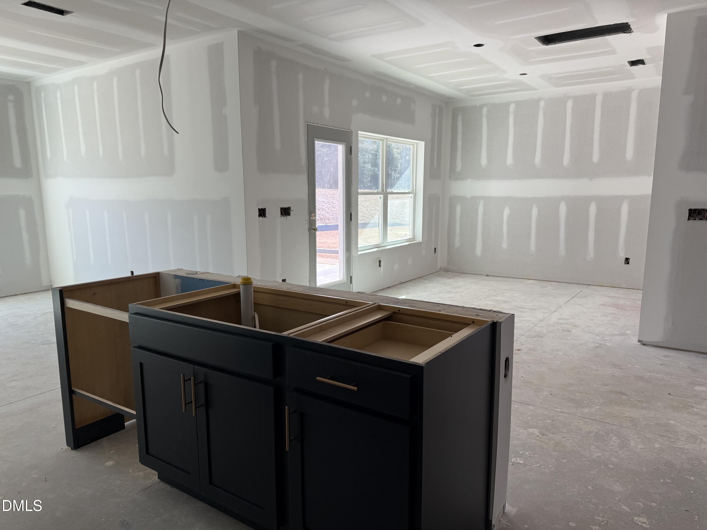 2205 Seraphic Way, Unit 403 Rolesville, NC 27571 - Photo 7 of 41 a kitchen that has a sink and a stove in it