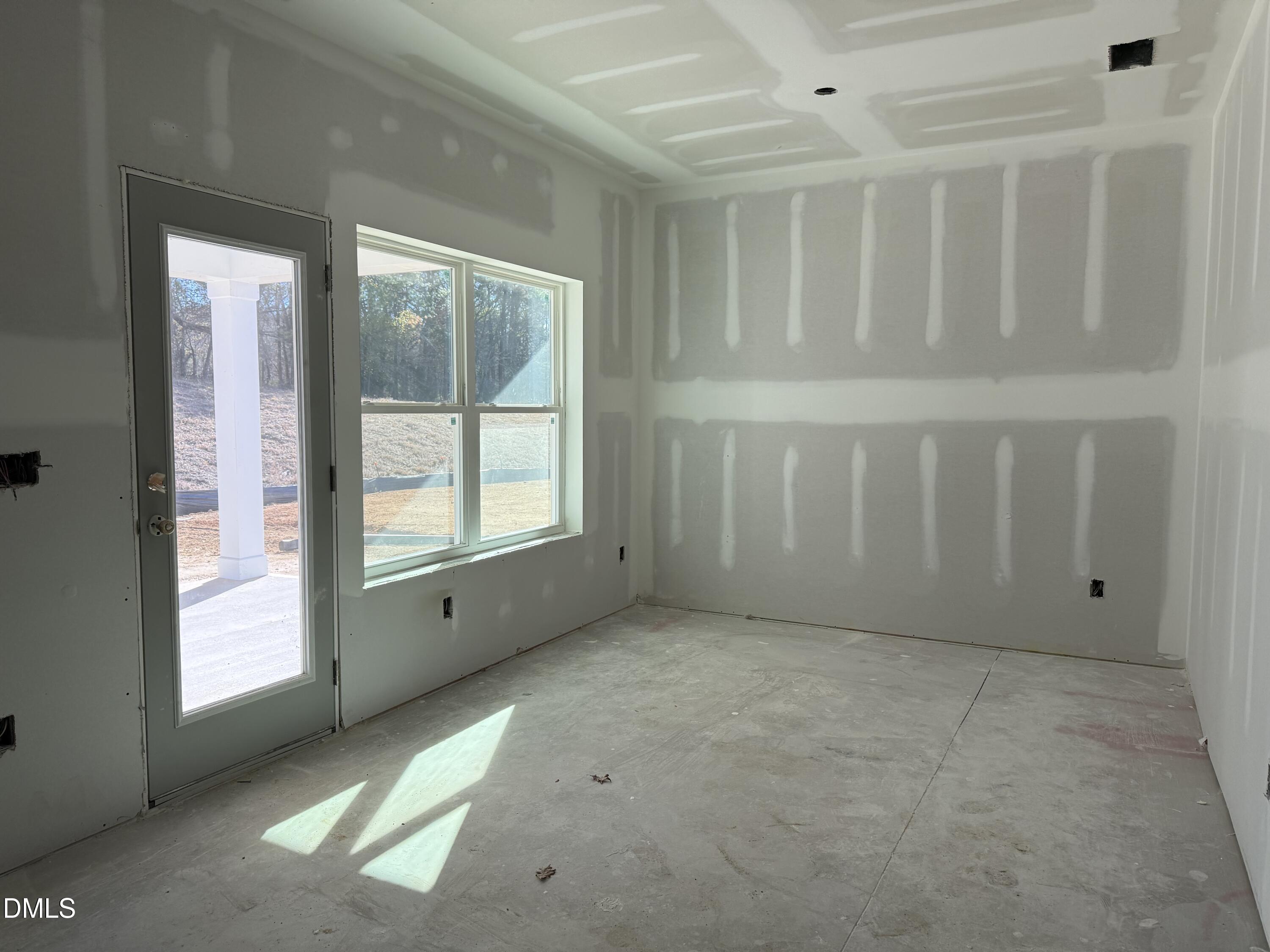 2205 Seraphic Way, Unit 403 Rolesville, NC 27571 - Photo 8 of 41 an empty room with windows