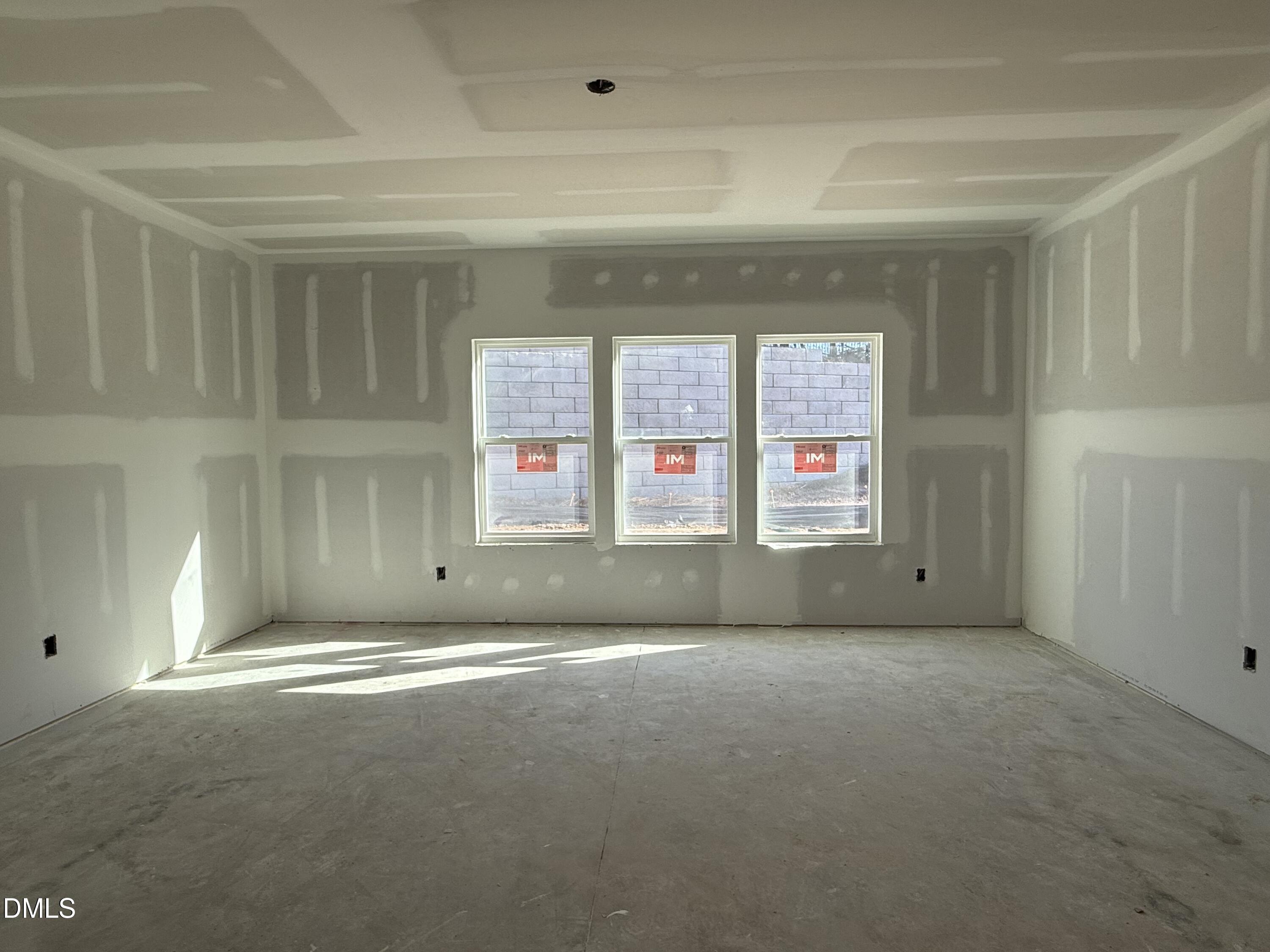 2205 Seraphic Way, Unit 403 Rolesville, NC 27571 - Photo 9 of 41 a view of an empty room with a window