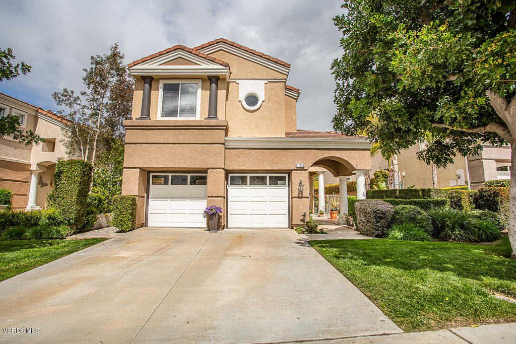 11249 Shadyridge Road Moorpark, CA 93021 - Photo 1 of 48 a front view of a house with a yard and trees